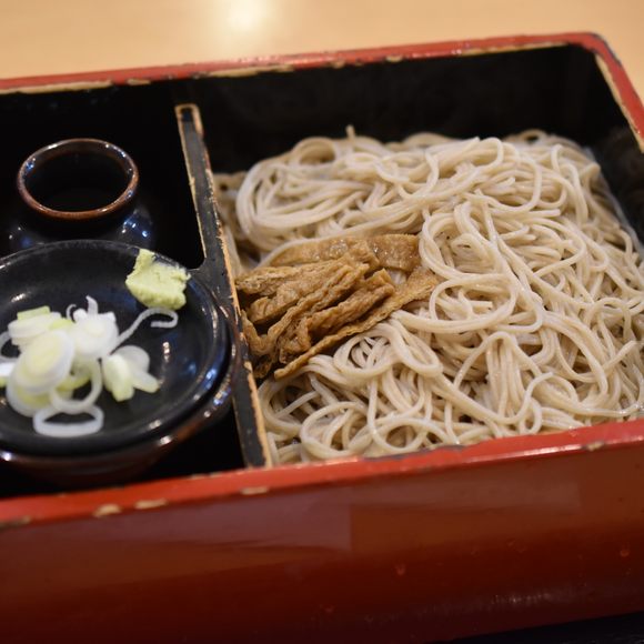 A simple box of soba noodles with aburaage (fried tofu), the foxes’ favorite food.