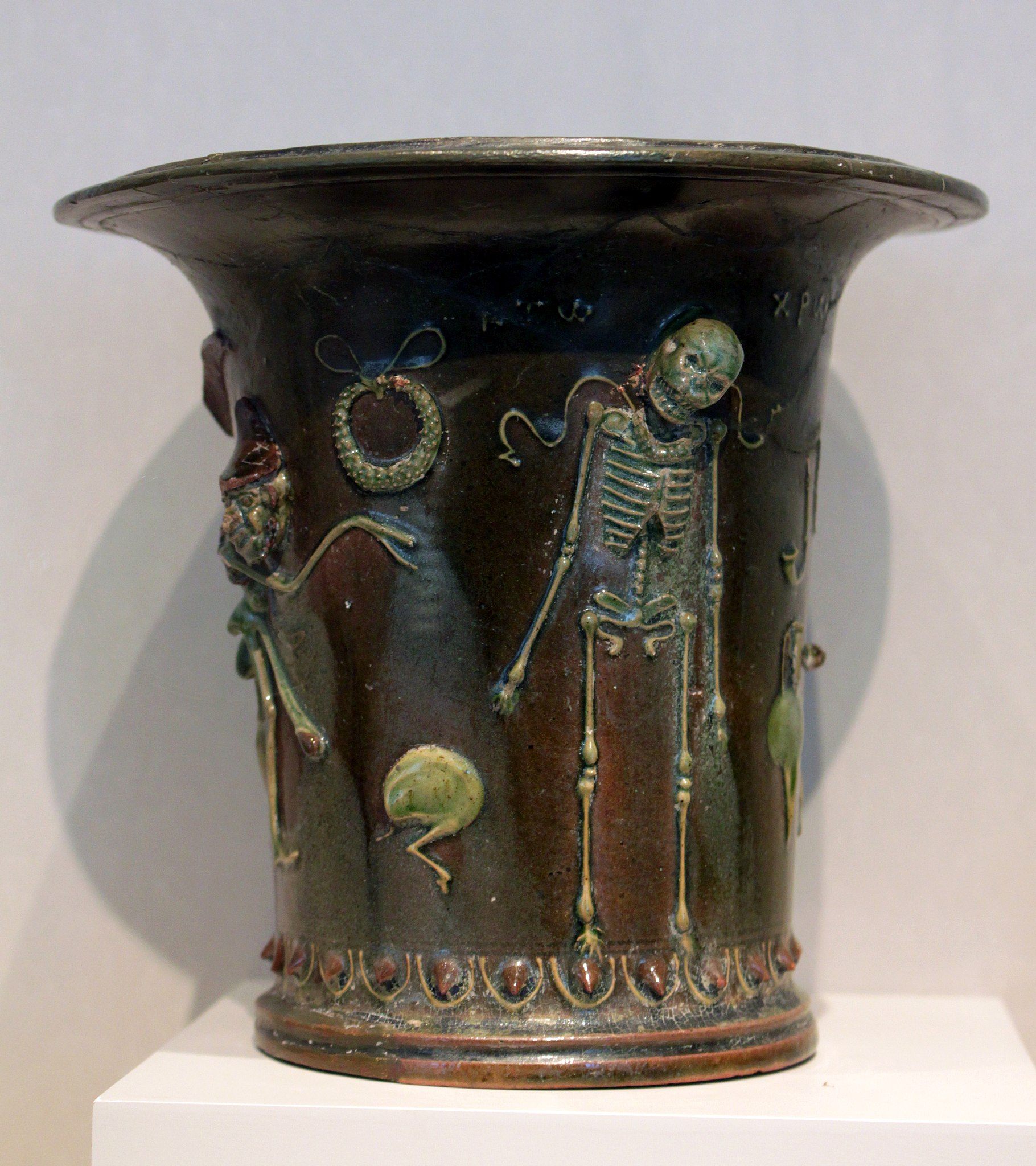 An ancient Roman ceramic drinking cup dated to approximately the first century BC to the first century CE.