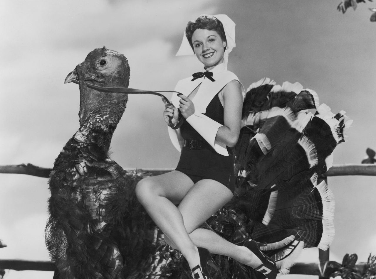 Actress Virginia Gibson, photographed circa 1952, getting into the Thanksgiving spirit in a novel way. 