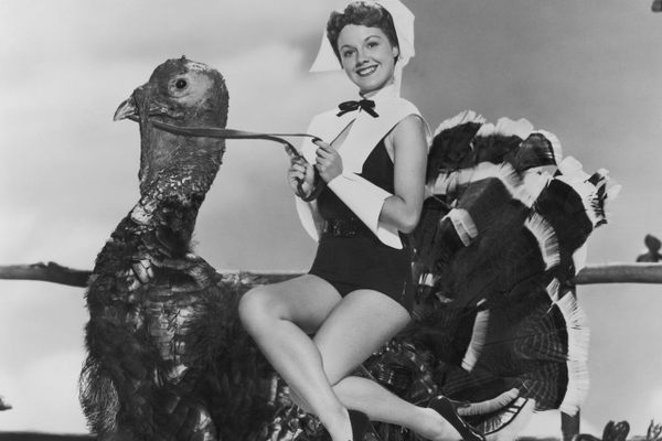 Actress Virginia Gibson, photographed circa 1952, getting into the Thanksgiving spirit in a novel way. 