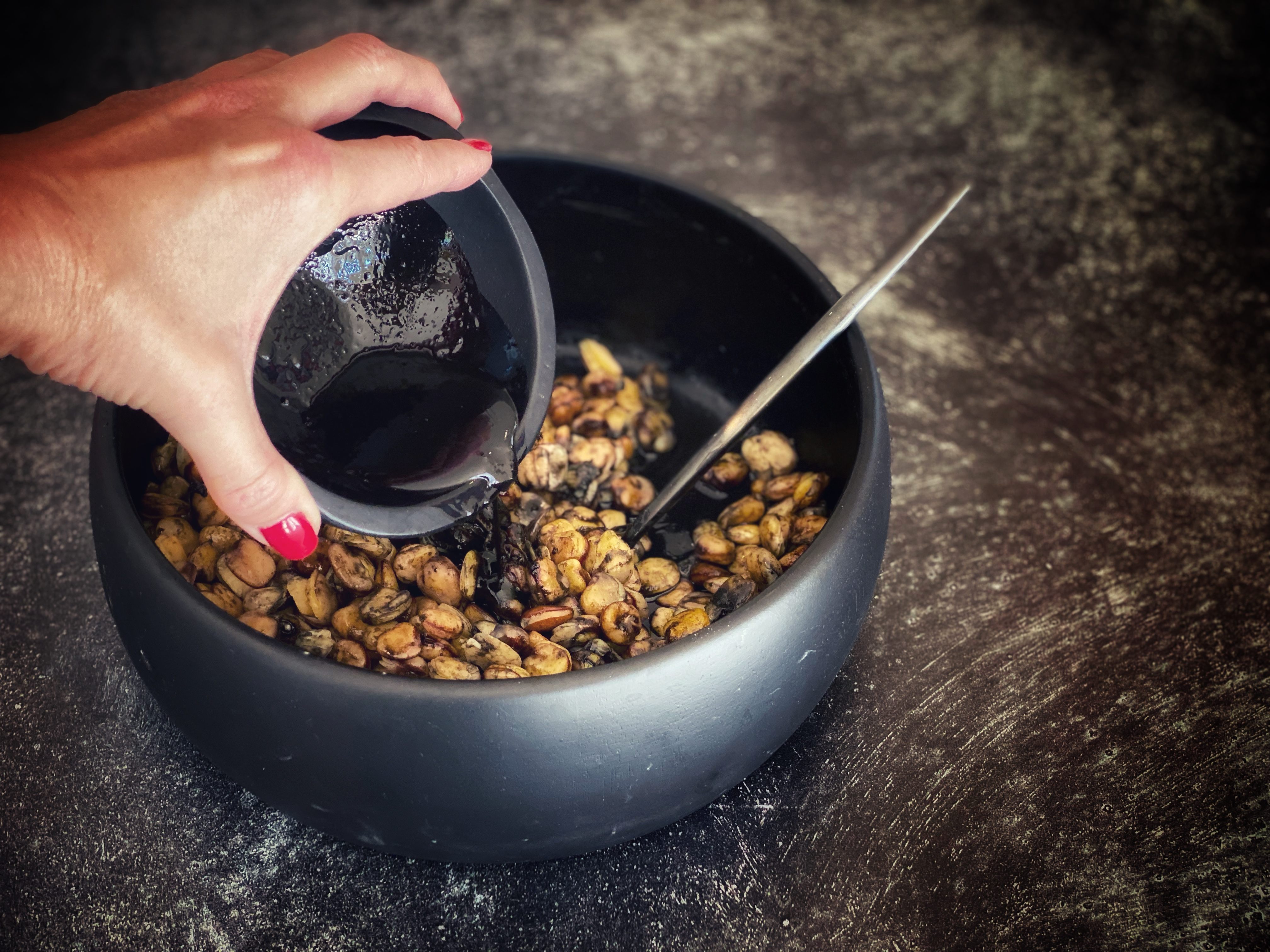 The cuttlefish ink dressing gives the beans a tangy punch.