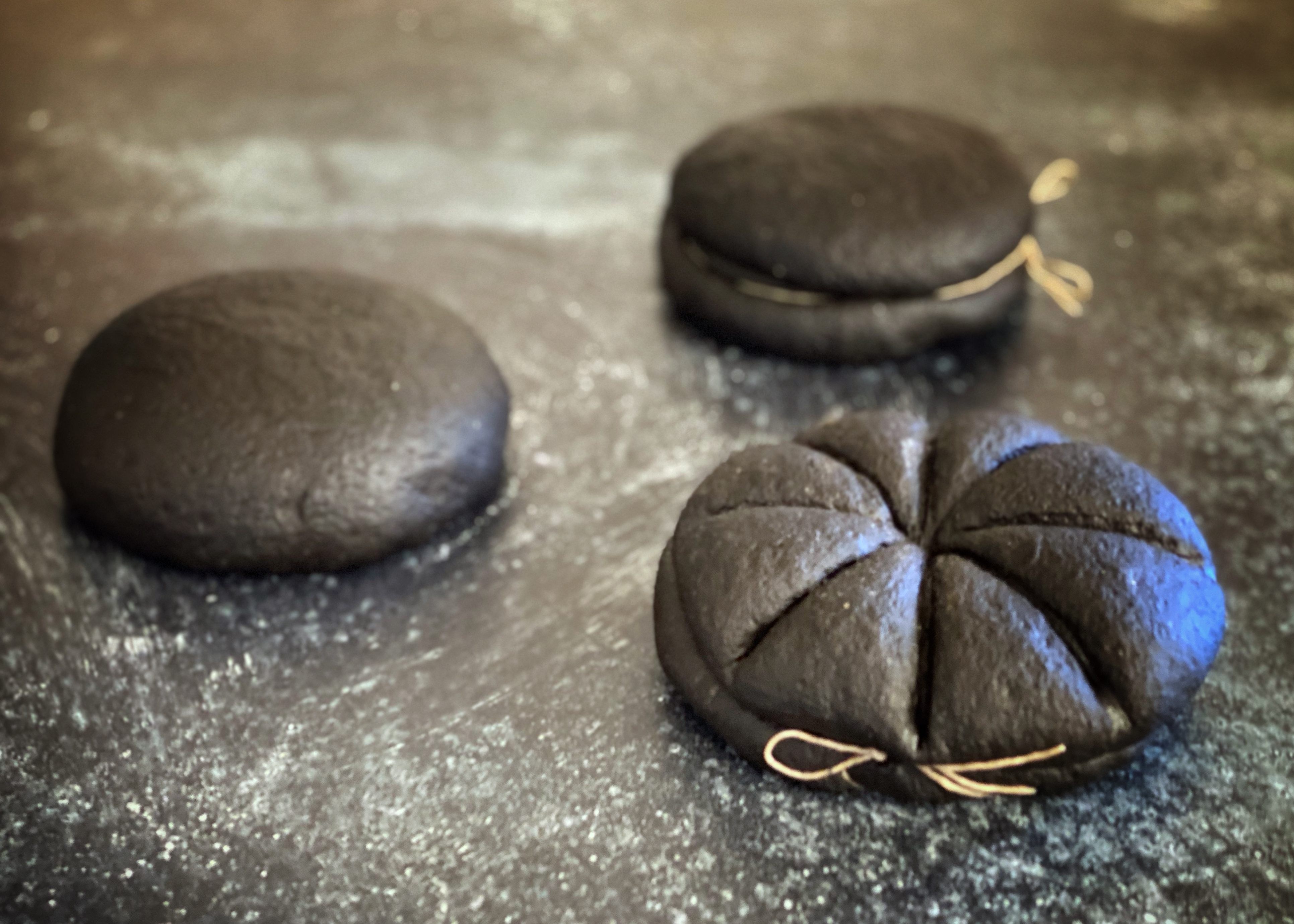 Thanks to a drop of cuttlefish ink, the loaves look gorgeously goth.