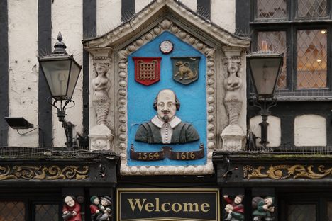 The Bard is represented on the sign. 